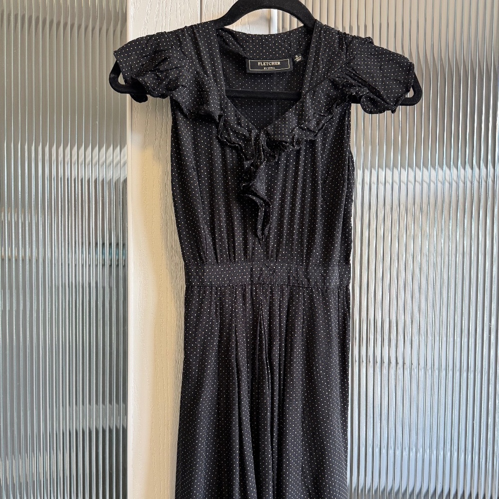 Black minidress with tan polka dots